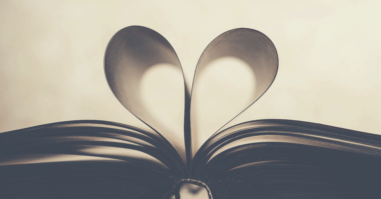 A book with two pages folded into a heart shape.