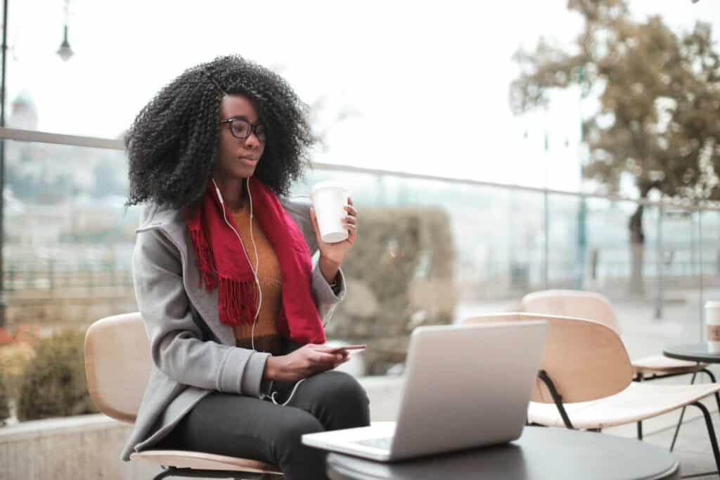 black lady on a laptop working. 