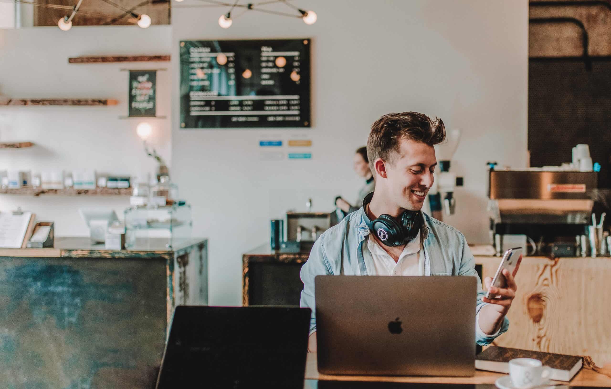 Man checking emails on a café