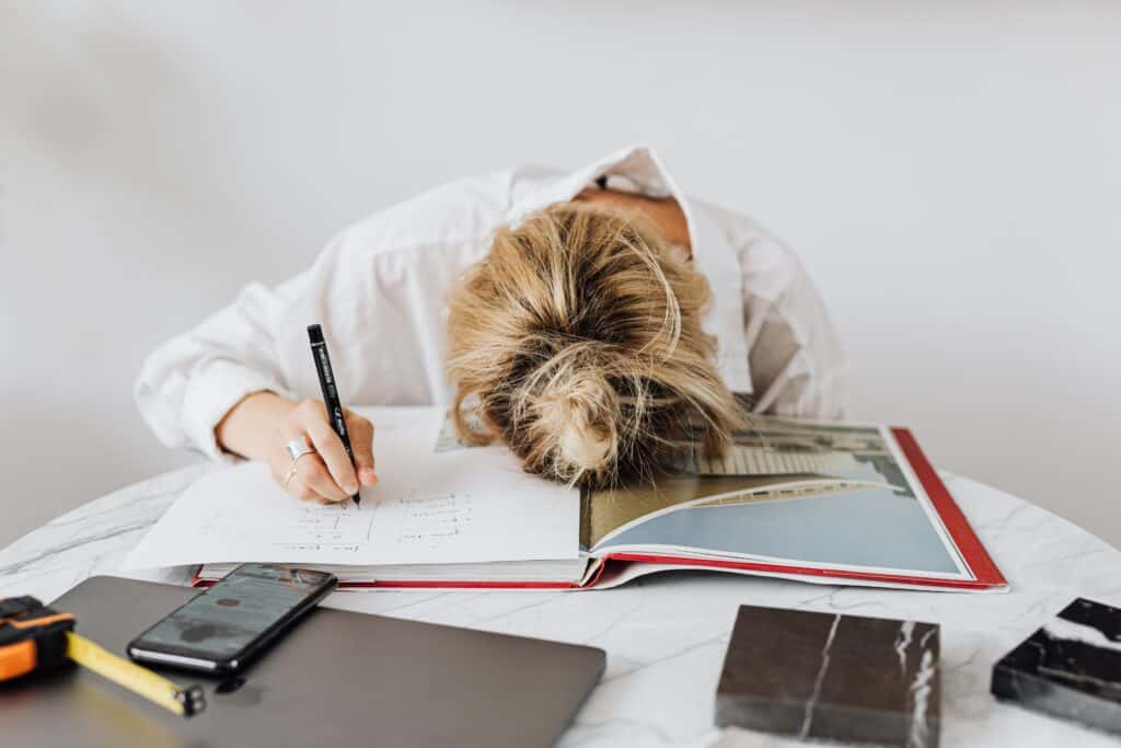 Businesswoman, asleep at a desk, overworked