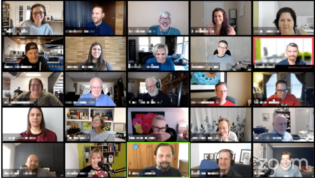 Screen of the gallery view of a Zoom video call with 20 people's faces, most are smiling or laughing