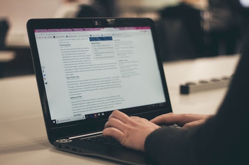 A person typing on a computer